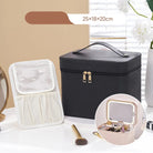 Black makeup travel case with LED mirror on a white surface with a beige wall background